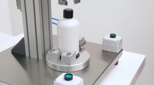 Tabletop capping machine for skincare and toiletries products
